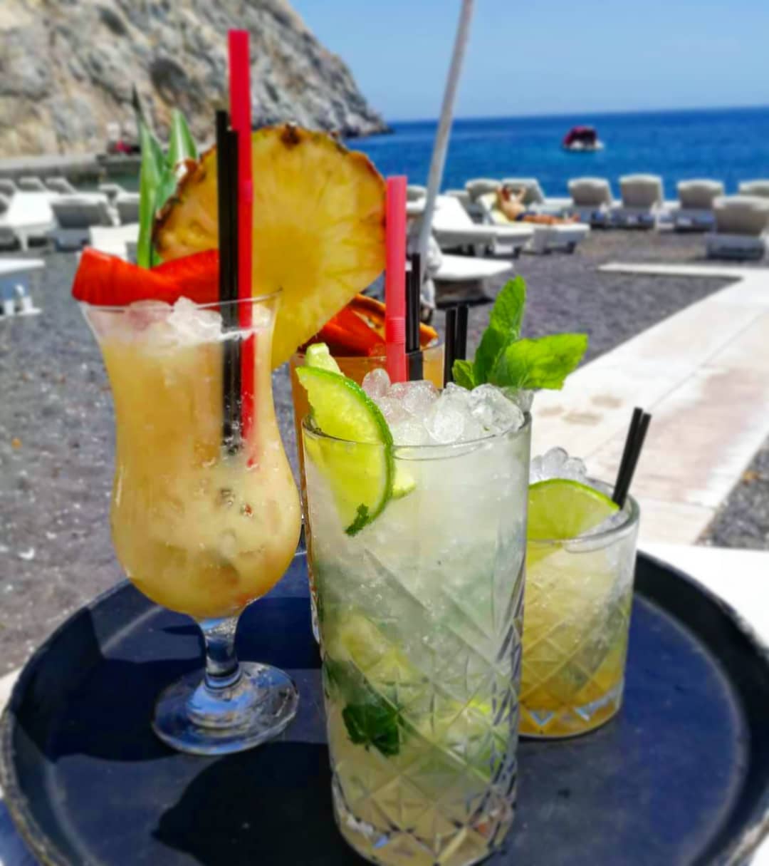 Demilmar cocktails on the beach in Santorini
