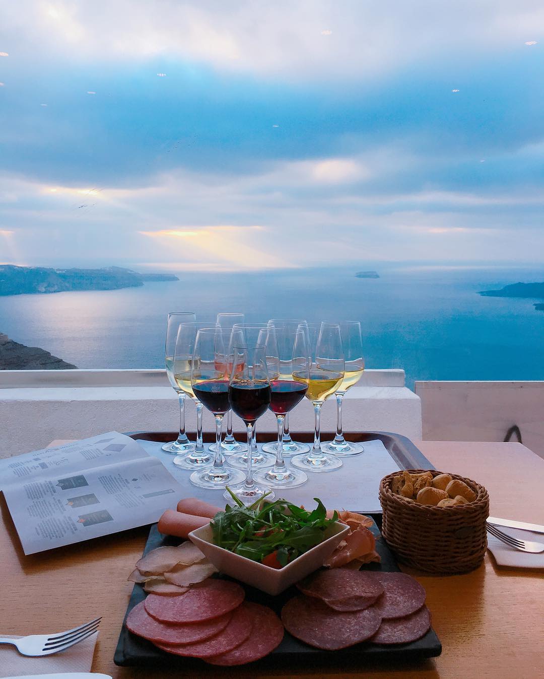 Santo Wines and charcuterie overlooking the water in Santorini